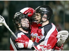 Calgary Roughnecks forward Dane Dobbie, seen here celebrating a Tracey Kelusky goal that would later be denied the last time they faced the Colorado Mammoth in the NLL West semifinal, scored the overtime winner Saturday at the Pepsi Center. (File)