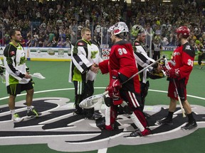 Goaltender Tyler
Carlson #30 (left) of the Saskatoon Rush, shakes hands with Calgary Roughnecks goalie Mike Poulin #30 (RIGHT) after a 12-9 win for the Saskatoon Rush
 at the SaskTel Centre in Saskatoon on May 21, 2016.