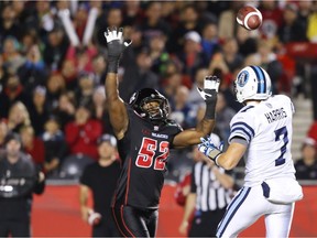 Shawn Lemon of the Ottawa Redblacks, left.