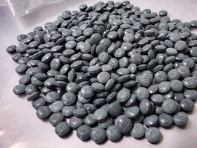 Fentanyl pills are shown in a police photo. Police and Alberta health officials are raising the alarm about a dangerous drug called W-18 that is believed to be much more toxic than fentanyl.