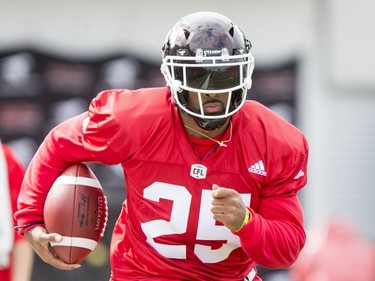 Lache Seastrunk carries a ball on Day 1 of the Calgary Stampeders rookie camp.