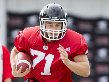 Pierre-Luc Caron carries a ball on Day 1 of the Calgary Stampeders rookie camp.