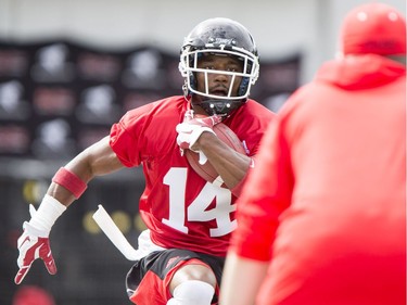 Reggie Whatley carries a ball on Day 1 of the Calgary Stampeders rookie camp at McMahon Stadium.