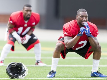 Roy Finch (R) and Reggie Whatley warm up on Day 1 of the Calgary Stampeders rookie camp.