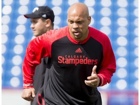 Guest coach and recently retired player Juwan Simpson watches the field on Day 1 of the Calgary Stampeders rookie camp at McMahon Stadium in Calgary, Alta., on Thursday, May 26, 2016. Regular training camp was set to begin on May 29.  Lyle Aspinall/Postmedia Network