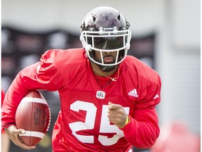 Lache Seastrunk carries a ball on Day 1 of the Calgary Stampeders rookie camp at McMahon Stadium in Calgary, Alta., on Thursday, May 26, 2016. Regular training camp was set to begin on May 29.  Lyle Aspinall/Postmedia Network