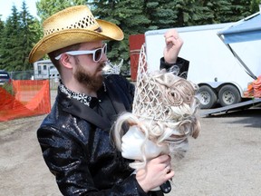 Sean Trechka carries in a wig and a tiara while getting ready at the 2014 Canadian Rockies International Rodeo and Music Festival on June 27, 2014 in Strathmore. The event is hosted by the Alberta Rockies Gay Rodeo Association.