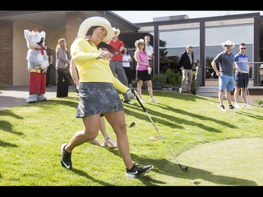 Would-be champ Lisa 'Longball' Vlooswyk reacts to a competitor's shot during the Shaw Charity Classic's annual Shootout at the Meadows at Canyon Meadows Golf and Country Club in Calgary, Alta., on Wednesday, May 18, 2016. The celebrity-and-media closest-to-the-pin driving contest is a precursor to the Shaw Charity Classic golf tournament set to begin Aug. 31. Lyle Aspinall/Postmedia Network
