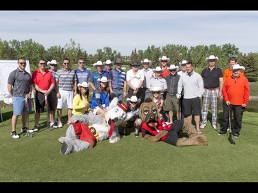 Competitors mug for a photo before the start of the Shaw Charity Classic's annual Shootout at the Meadows at Canyon Meadows Golf and Country Club in Calgary, Alta., on Wednesday, May 18, 2016. The celebrity-and-media closest-to-the-pin driving contest is a precursor to the Shaw Charity Classic golf tournament set to begin Aug. 31. Lyle Aspinall/Postmedia Network