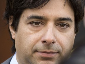 Jian Ghomeshi leaves a Toronto courthouse after signing a peace bond regarding a CBC employee who had claimed sexual harassment against him. The charges have now been dropped.