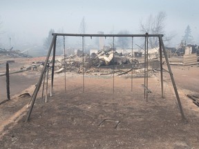 A burned swing set is all that's left in a neighbourhood destroyed by wildfire on May 6 in Fort McMurray.