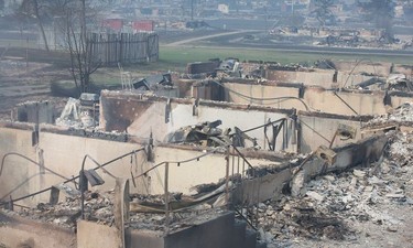 Home foundations are all that remain in a residential neighborhood destroyed by wildfire in Fort McMurray