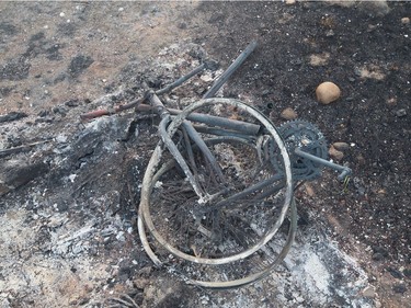 The remains of a charred bicycle sits in a residential neighborhood on May 6, 2016 in Fort McMurray.