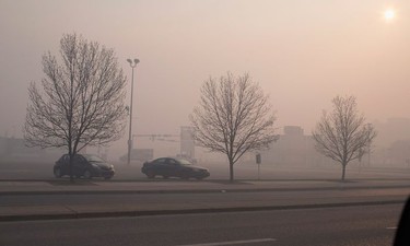 FORT MCMURRAY, AB - MAY 06:  Smoke from wildfires fill the morning air on May 6, 2016 in Fort McMurray, Alberta, Canada. Wildfires, which are still burning out of control, have forced the evacuation of more than 80,000 residents from the town.