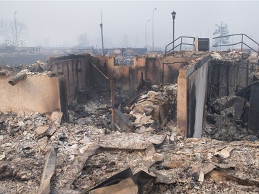 Home foundations are all that remain in a residential neighborhood destroyed by a wildfire  in Fort McMurray.