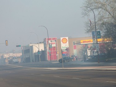 Smoke from wildfires fill the morning air near a gas station on May 6, 2016 in Fort McMurray.