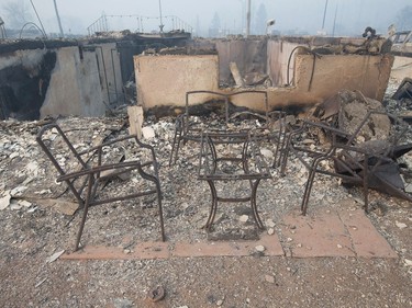 Home foundations and remains of possessions are nearly all that remain in a residential neighborhood destroyed by a wildfire in Fort McMurray.