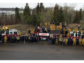 Fort McMurray fire department sends a group shot for all the mothers and wives missed on this Mother's Day as they fight the wildfire. The card reads: “Mom ... A lifetime of love!”