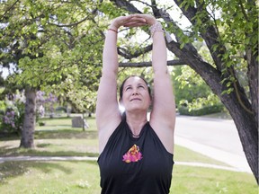 Yoga Instructor Johanna Steinfeld demonstrates Urdvha Hasta Tadasana Arms for her June 2016 yoga column. (Kerianne Sproule/Postmedia)