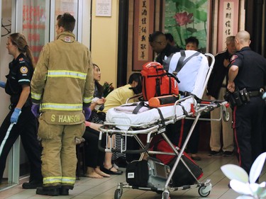 Police and emergency workers deal with a stabbing incident in the Perpetual Wellness Chinese Medicine Centre on Thursday June 16, 2016