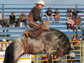 Clay Elliott of Nanton rides Devil's Who in the Saddle Bronc competition at the Airdrie Pro Rodeo Thursday evening June 28, 2016.