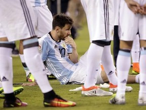 Argentina&#039;s Lionel Messi waits for trophy presentations after the Copa America Centenario championship soccer match, Sunday, June 26, 2016, in East Rutherford, N.J. Chile defeated Argentina 4-2 in penalty kicks to win the championship. (AP Photo/Julie Jacobson)