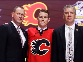 Matthew Tkachuk celebrates with the Calgary Flames after being selected sixth overall during round one of the 2016 NHL Draft on June 24, 2016 in Buffalo, New York.