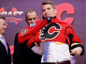 BUFFALO, NY - JUNE 24:  Matthew Tkachuk celebrates with the Calgary Flames after being selected sixth overall during round one of the 2016 NHL Draft on June 24, 2016 in Buffalo, New York.