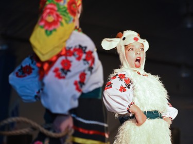 Abigail Plesa reacts during a traditional dance, depicting shepherding, at the Calgary Ukrainian Festival in Calgary on Sunday, June 5, 2016.Elizabeth Cameron/Postmedia