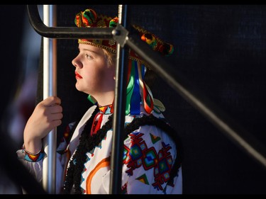 Natalia Ewanek, 13, watches dances from backstage at the Calgary Ukrainian Festival, in Calgary on Sunday, June 5, 2016.Elizabeth Cameron/Postmedia