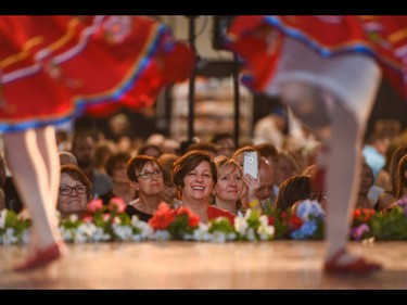 Emily Leclair watches her daughter dance at the Calgary Ukrainian Festival in Calgary on Sunday, June 5, 2016. The event had over 800 dancers alone. Elizabeth Cameron/Postmedia