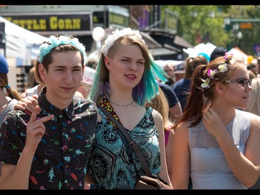 Flower children MacKenzie Humphreys, Cecilia Hollier and Liza Patapenka at the annual 4th Street Lilac Festival in Calgary, Ab., on Sunday June 5, 2016. Mike Drew/Postmedia