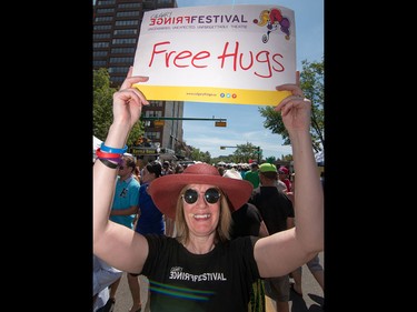 Michelle Gallant was giving out free hugs at the annual 4th Street Lilac Festival in Calgary, Ab., on Sunday June 5, 2016. Mike Drew/Postmedia
