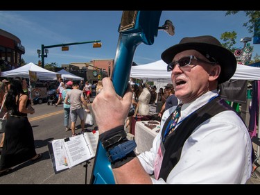 Hans "The Thumb" Sahlen thumps out a tune at the annual 4th Street Lilac Festival in Calgary, Ab., on Sunday June 5, 2016. Mike Drew/Postmedia