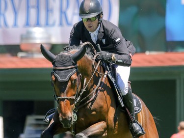 Ireland's Conor Swail and Cenzo head for the win in the ATCO Classic at the Spruce Meadows National in Calgary, Ab., on Sunday June 12, 2016. Mike Drew/Postmedia