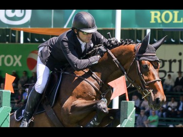 Ireland's Conor Swail and Cenzo head for the win in the ATCO Classic at the Spruce Meadows National in Calgary, Ab., on Sunday June 12, 2016. Mike Drew/Postmedia