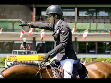 Ireland's Conor Swail and Cenzo salute the crowd as they take the win in the ATCO Classic at the Spruce Meadows National in Calgary, Ab., on Sunday June 12, 2016. Mike Drew/Postmedia