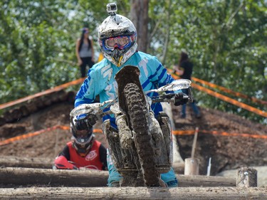 Jacob Karas, from Calgary, rides over a jump with a GoPro attached to his helmet at the Redbull Chasing Limits Motocross competition in Calgary on June 26, 2016.