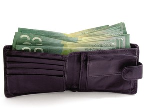A wallet full of $20 bills