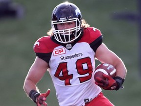 Alex Singleton, a new Canadian, will carry the country's flag onto the field before the Calgary Stampeders Canada Day match against the Winnipeg Blue Bombers on July 1, 2016. (Courtesy Calgary Stampeders)