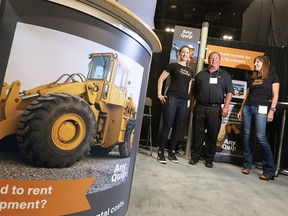 Staff at AnyQuip from left, Leslie Stempfle, Frank Papineau and Jen Lussier were photographed in their company's booth at the Global Petroleum Show in the BMO Centre on Tuesday June 7, 2016.  (Gavin Young/Postmedia)