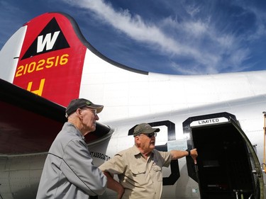 Canadian World War II veteran Doug Curtis chats with crew of the Aluminum Overcast, a B17 Flying Fortress is readied for a flight at the Springbank Airport outside Calgary on Wednesday June 22, 2016. The WW II bomber is owned by the U.S. based Experimental Aircraft Association who will take people on flights in the vintage aircraft. Flights are used as a fundraiser for the organization to help restore and maintain vintage aircraft. Curtis was a Royal Air Force tail gunner in a Lancaster bomber who flew on the B-17 Wednesday.