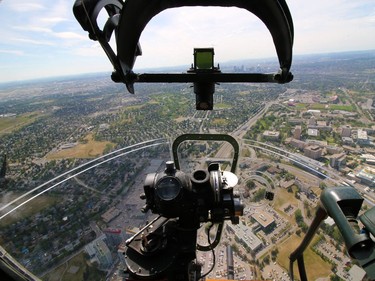 Calgary is seen through the nose turret of Aluminum Overcast, a B17 Flying Fortress, as it flies over the western side of the city on Wednesday June 22, 2016. The WW II bomber is owned by the U.S. based Experimental Aircraft Association who will take people on flights in the vintage aircraft. Flights are used as a fundraiser for the organization to help restore and maintain vintage aircraft.