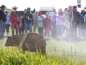 Farmers, ranchers and families learn how to use bear spray after a lecture and talk about bear safety at the Bar U Ranch on June 17, 2016.