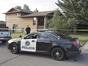 Police investigating at a home in Beddington Drive N.E. on Monday, June 27, 2016, the morning after a violent home invasion.
