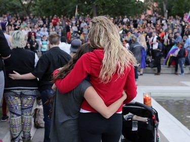 Calgarians take part in a vigil in Olympic Plaza  on Sunday evening June 12, 2016 for the victims of the Pulse Nightclub shooting in Orlando.