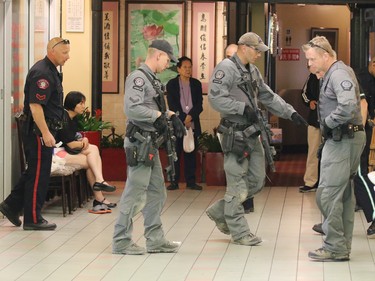 Police deal with a stabbing incident in the Perpetual Wellness Chinese Medicine Centre on Thursday June 16, 2016