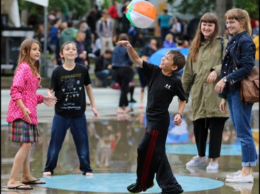 Kids have fun between performances in Olympic Plaza during the Sled Island Music Festival in Calgary on Saturday June 25, 2016.