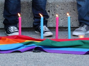 Calgarians took part in a vigil in Olympic Plaza  on Sunday evening June 12, 2016 for the victims of the Pulse Nightclub shooting in Orlando.