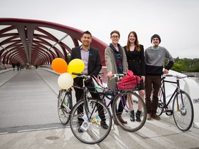Gerardo Marquez, Signe Bray, Cheryl Johnson, and Colin Sproule of Cyclepalooza are photographed at the Peace Bridge in downtown Calgary in 2014.